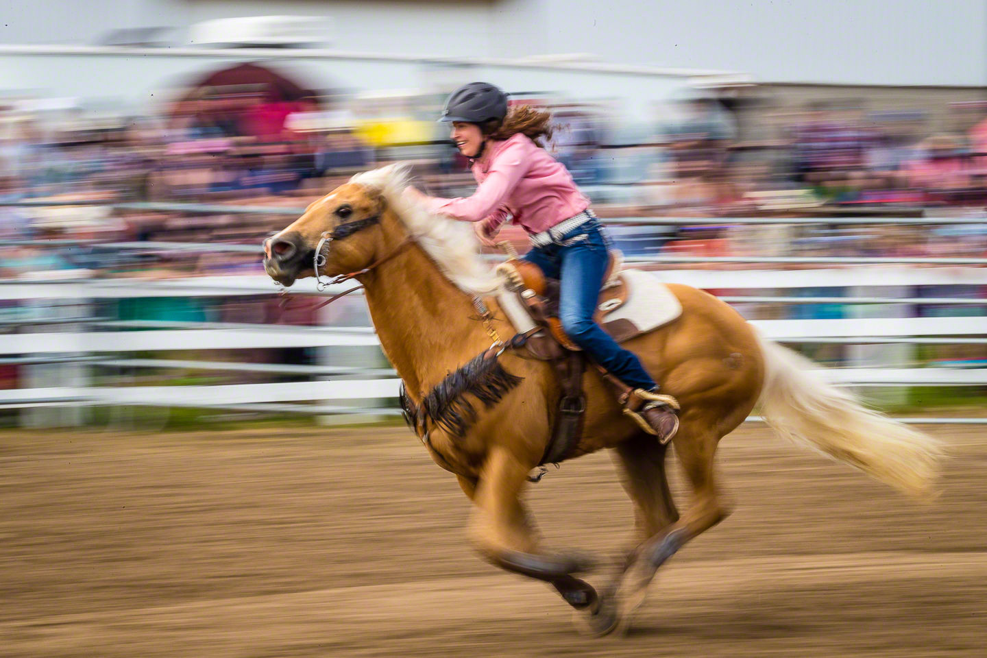 Camera in continuous auto focus, with me tracking the rider and holding down the AF-ON button with a slow shutter speed and a pan to capture the motion of the horse and rider. Without back button focus, this shot would not have happened as successfully.