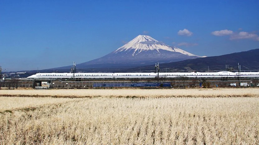 the shinkansen passing through a splendid view of mount fuji.