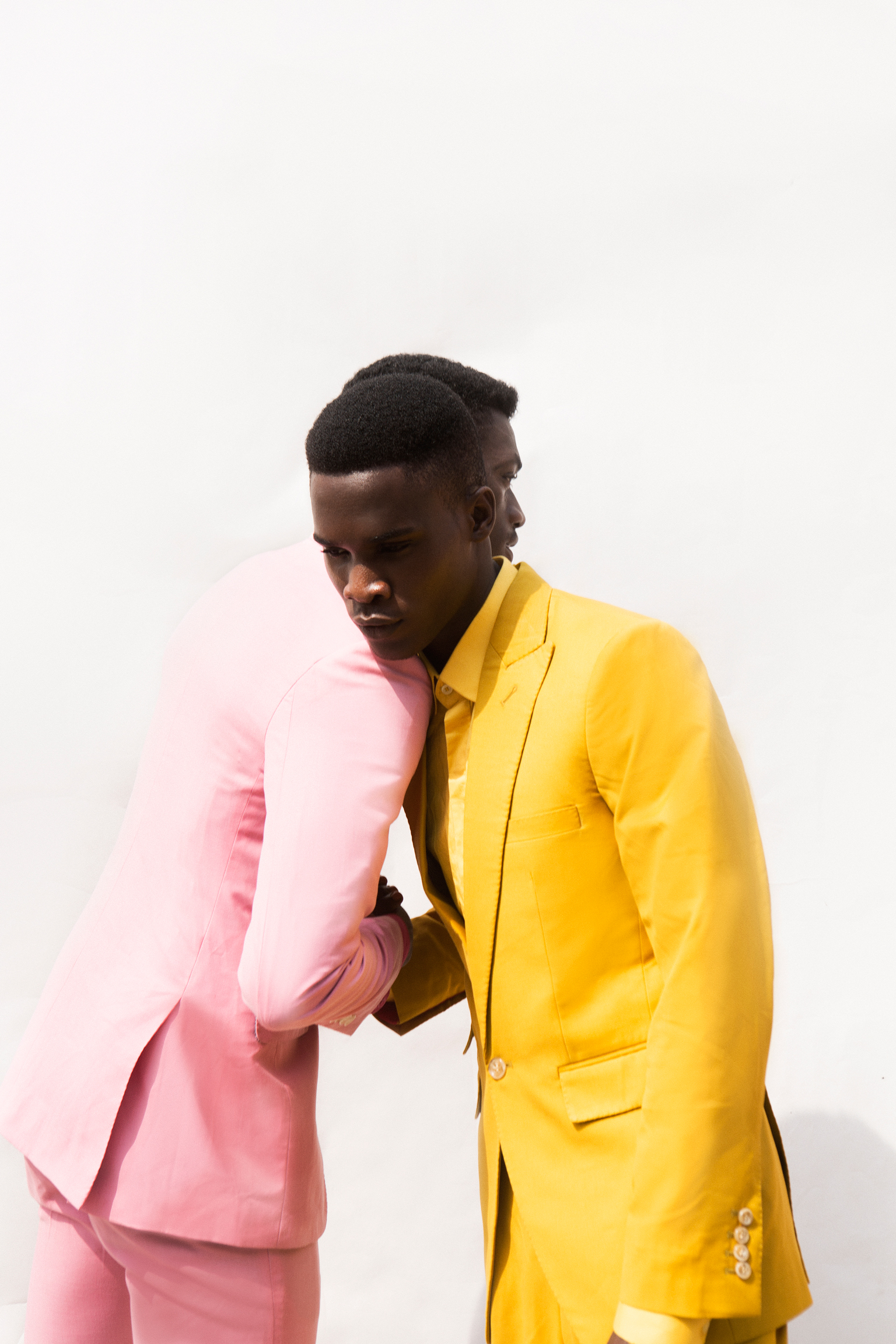 Toyin and Dami wear suits, both McMeka