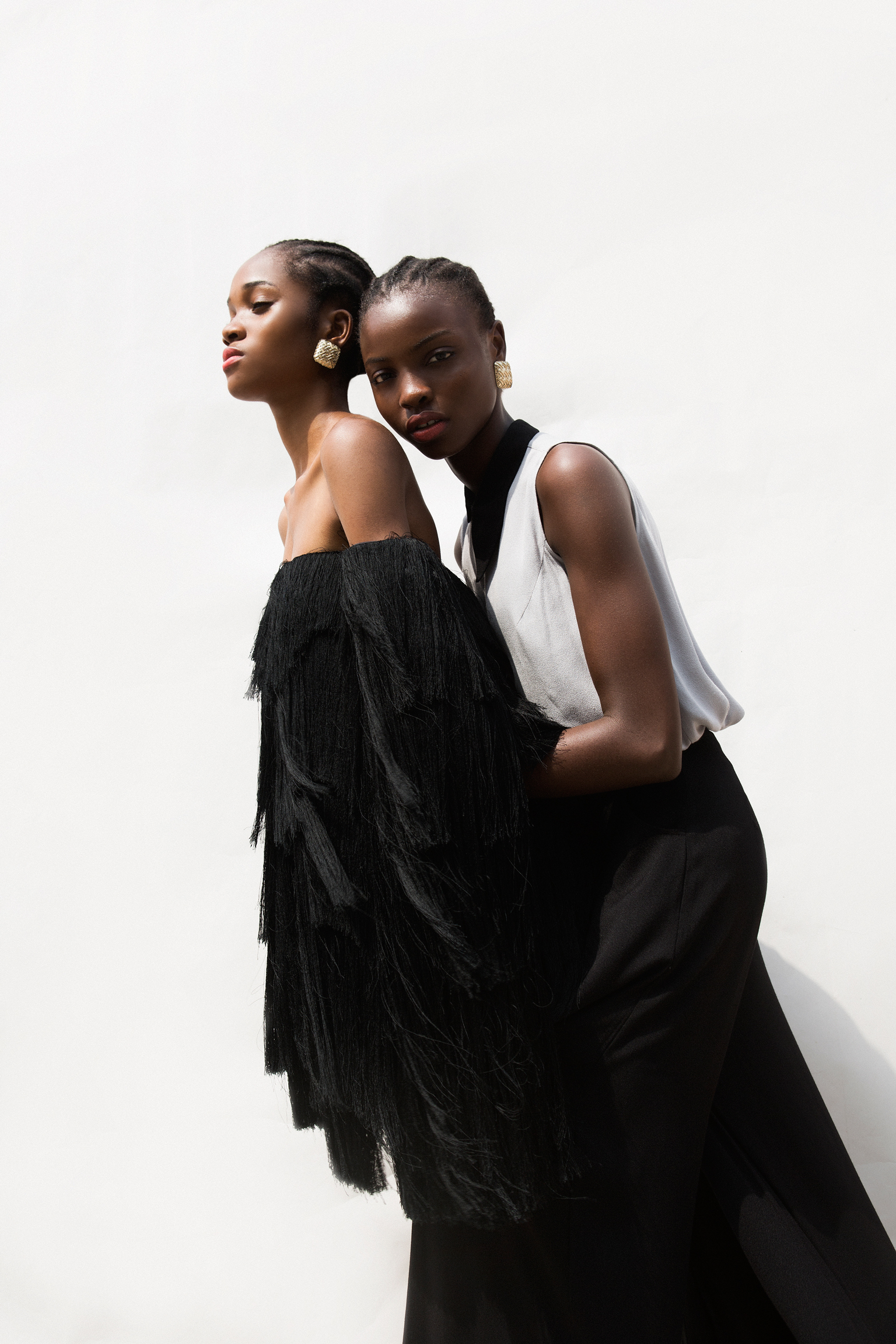 Nora wears dress, Maki Oh Olamide wears top and trousers, Maki Oh