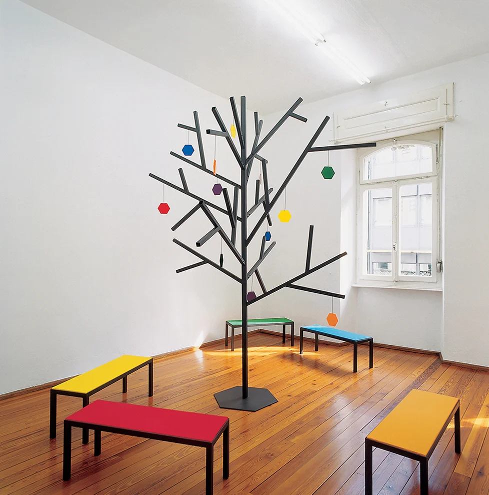 The installation seeks to offer a platform for discussion and reflection on notions such as Utopia, education, language, models of thought, institutionalised structures and on themes such as the mediation of knowledge and information. "The space is on the second floor, I've had the feeling it could be an apartment, or maybe more a place where people would gather, or meet. Still, a place that is not entirely public as well as not entirely private. Its familiar features are embodied in the architecture of the space, with the wooden floor and the door frames and the radiators. And the large windows from which one can hear the cars passing by underneath."