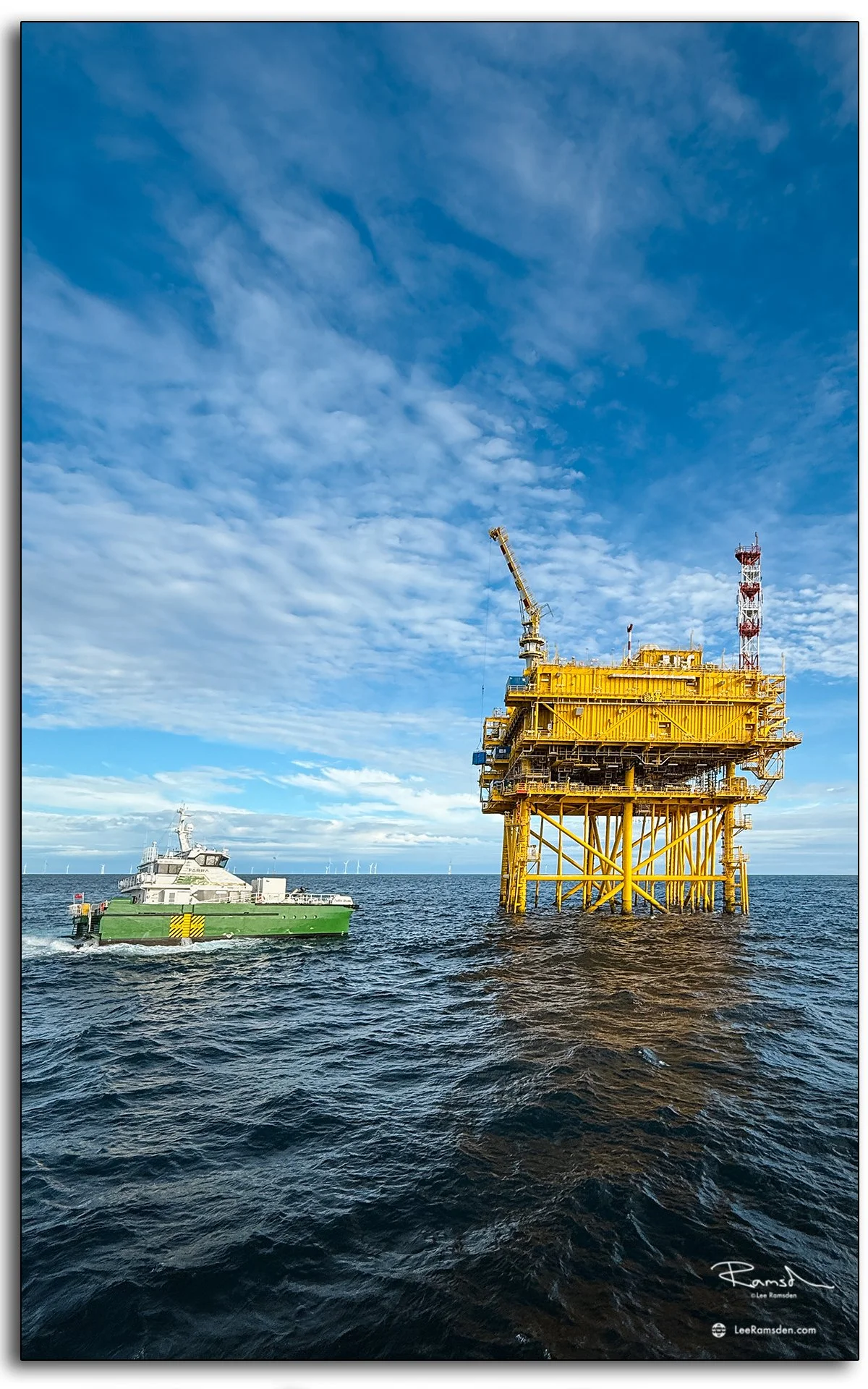 CTV vessel Farra Grainne alongside offshore substation in North Sea wind farm, supporting renewable energy operations at sea