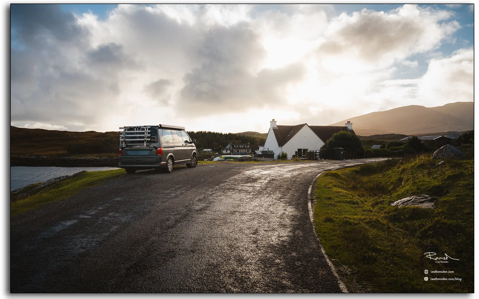 Campervan parked on a quiet road near the Seal Viewpoint, Isle of Harris, with sunset light over the Outer Hebrides hills