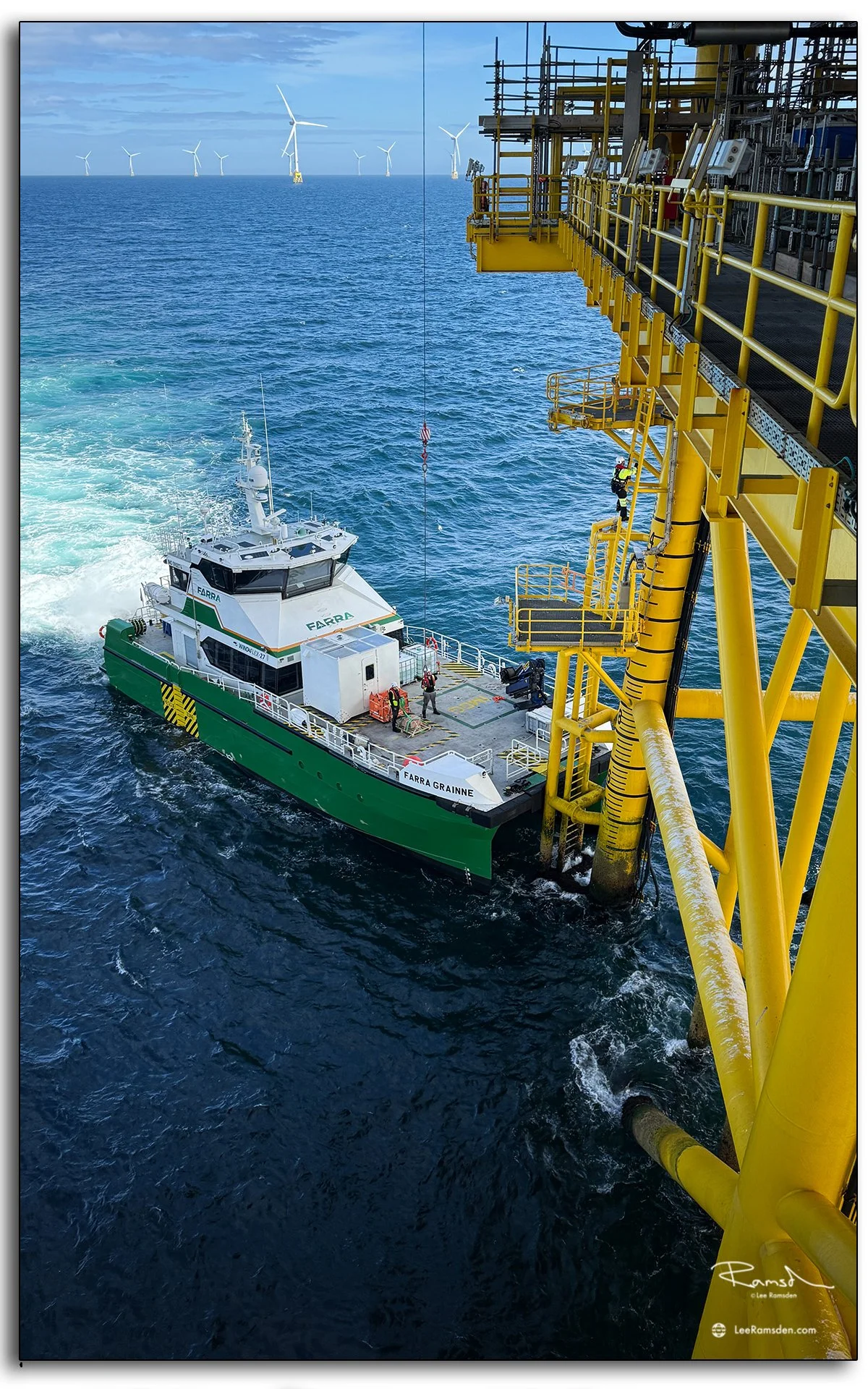 CTV Farra Grainne alongside offshore wind platform, safe crew transfer in progress.