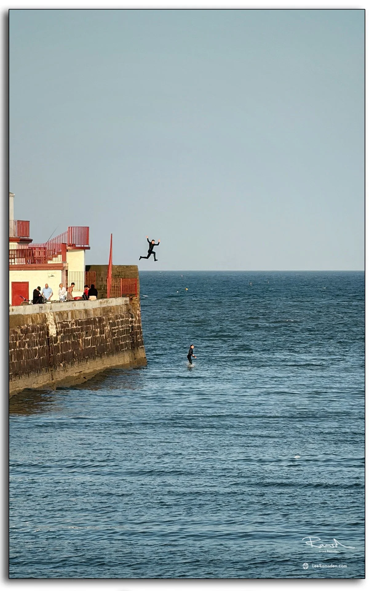 Action at Arbroath Harbour as a local leaps from the harbour wall into the sea.