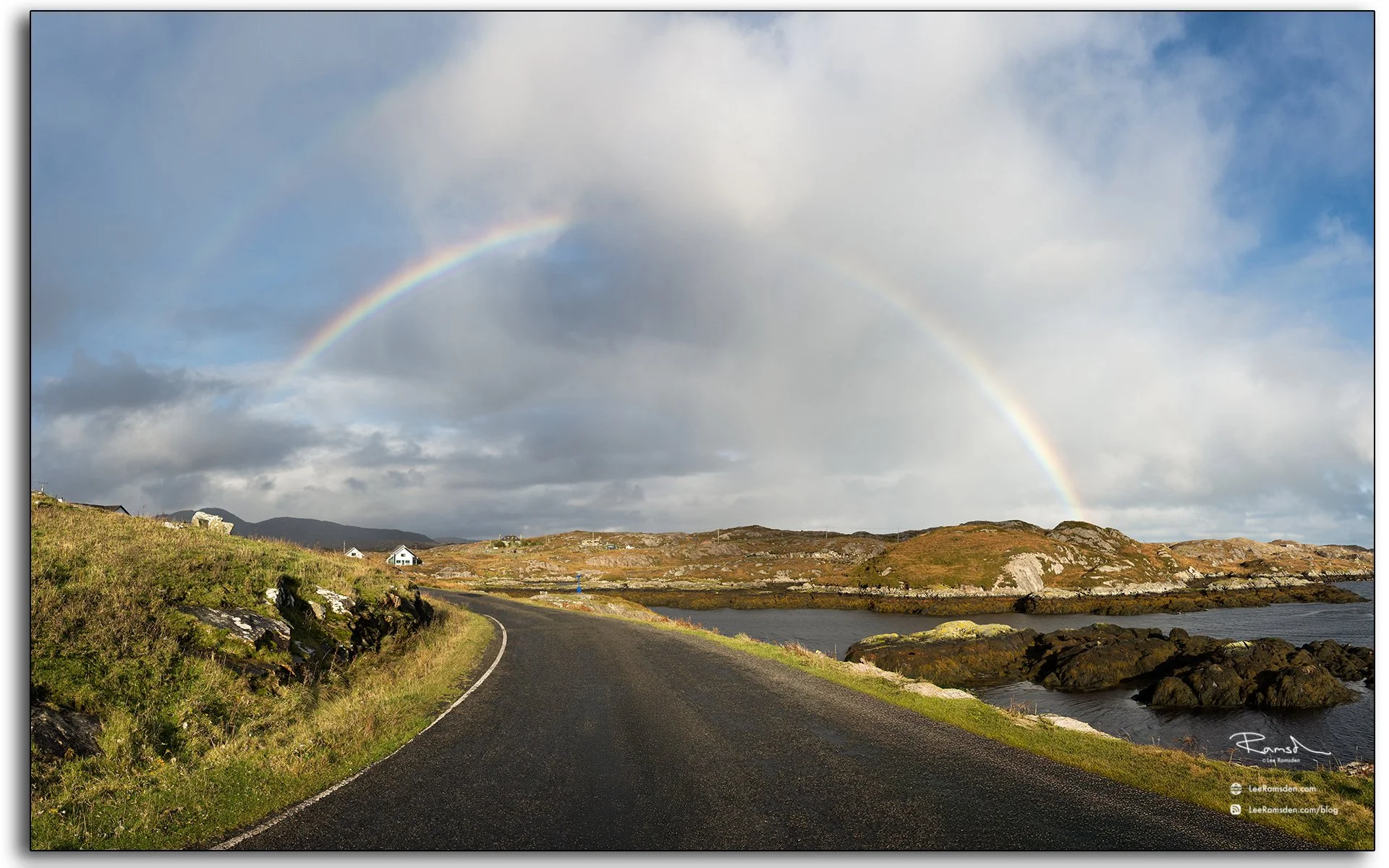 Double rainbow over a winding coastal road near the Seal Viewpoint, Isle of Harris, Outer Hebrides, Scotland