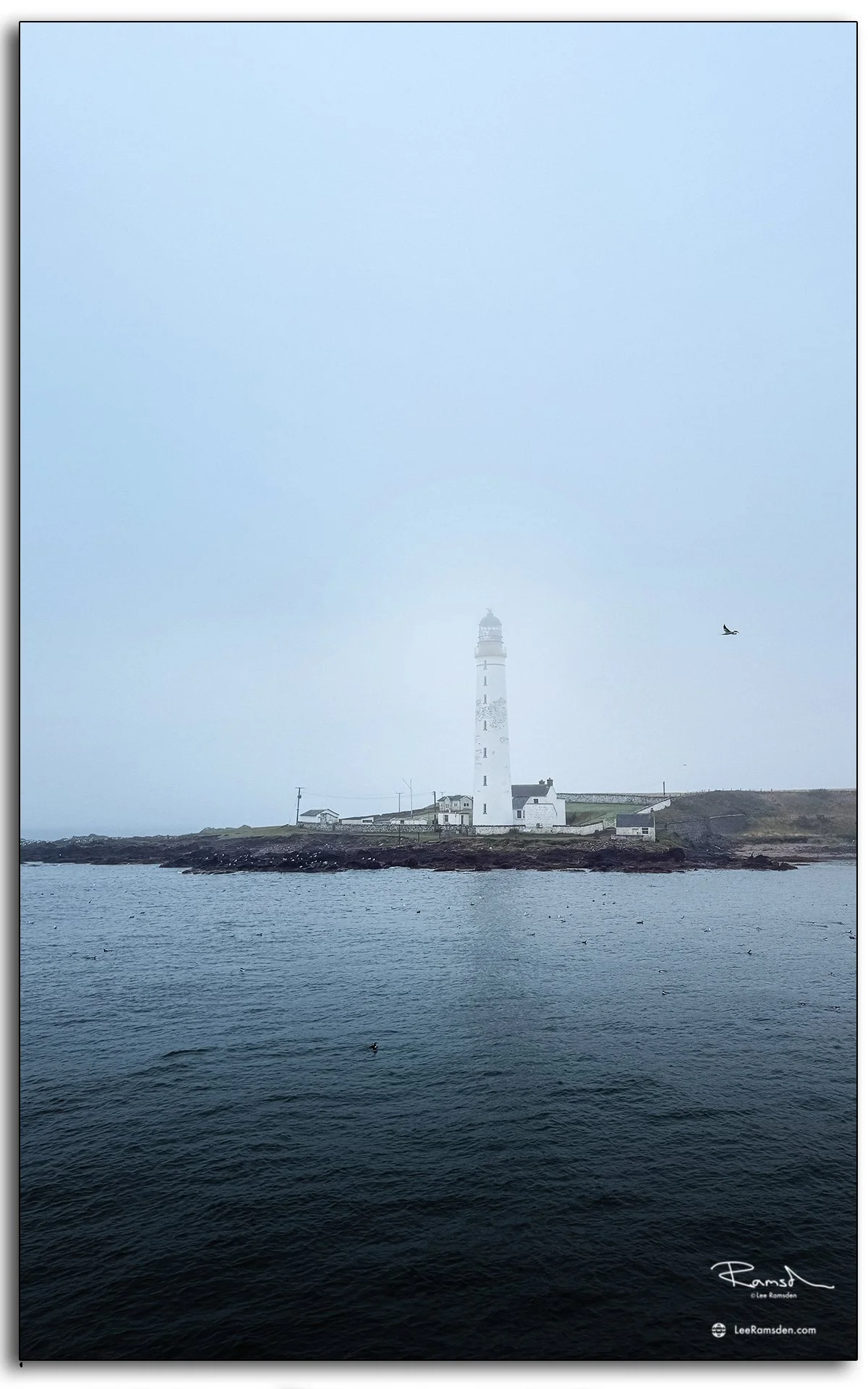 Scurdie Ness Lighthouse shrouded in sea mist on the Angus coast