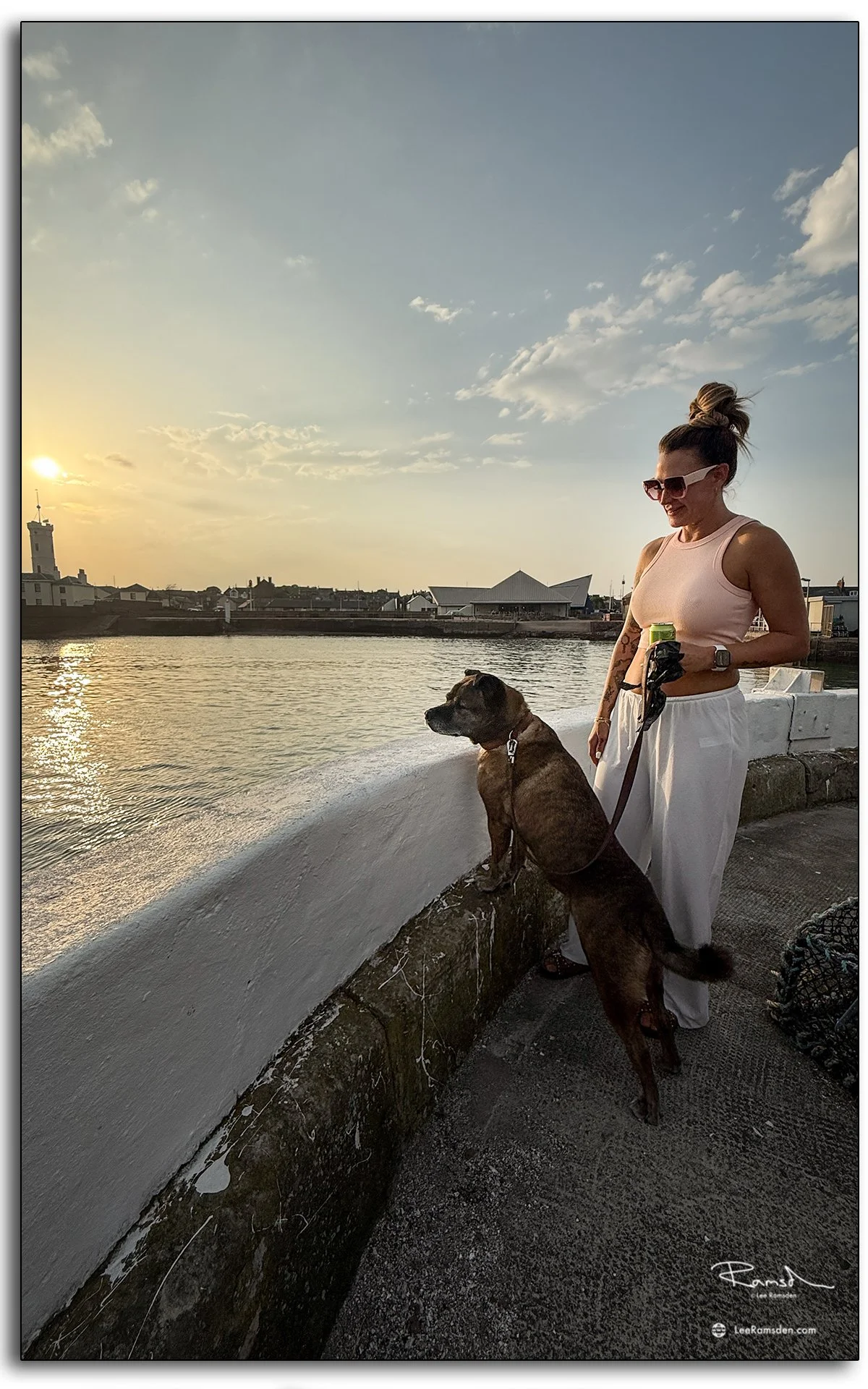 Evening walk at Arbroath Harbour, with golden light reflecting on the water.
