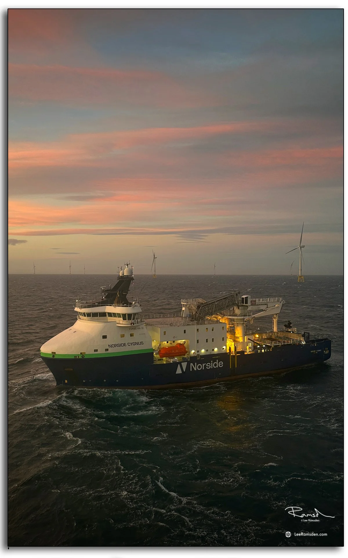 Norside Cygnus offshore vessel at sunset, supporting wind farm operations in the North Sea.