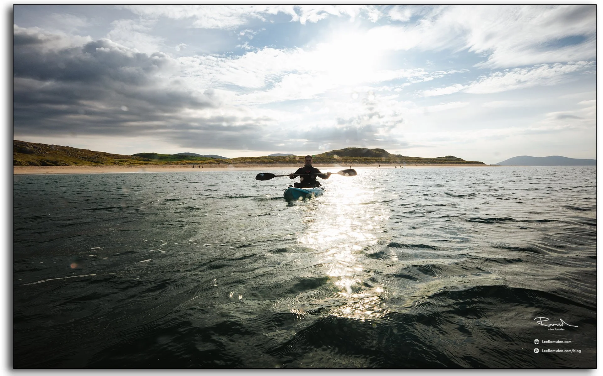 Man paddling kayak on Luskentyre Beach, Isle of Harris, Outer Hebrides, Scotland