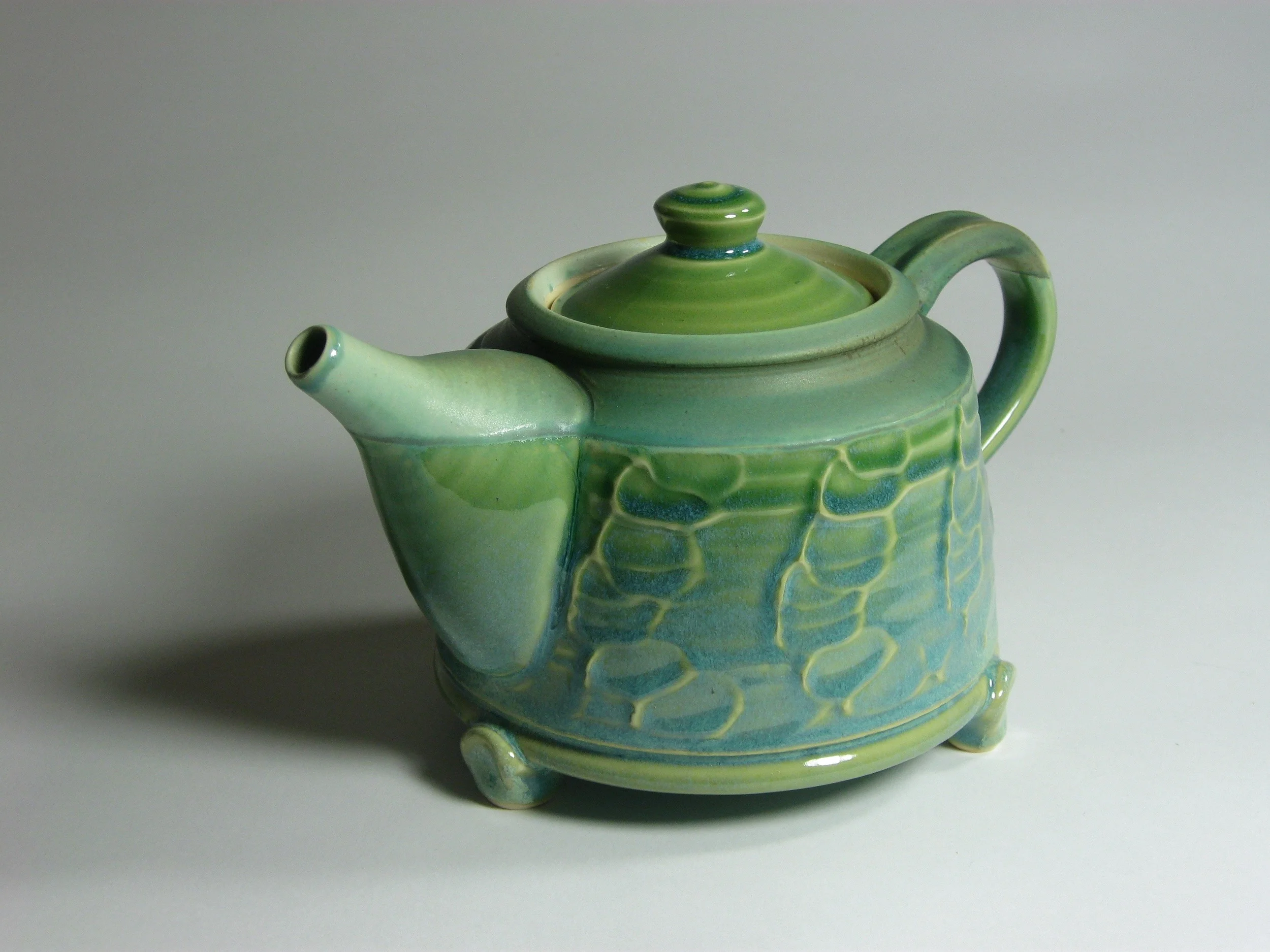 Slip decorated teapot