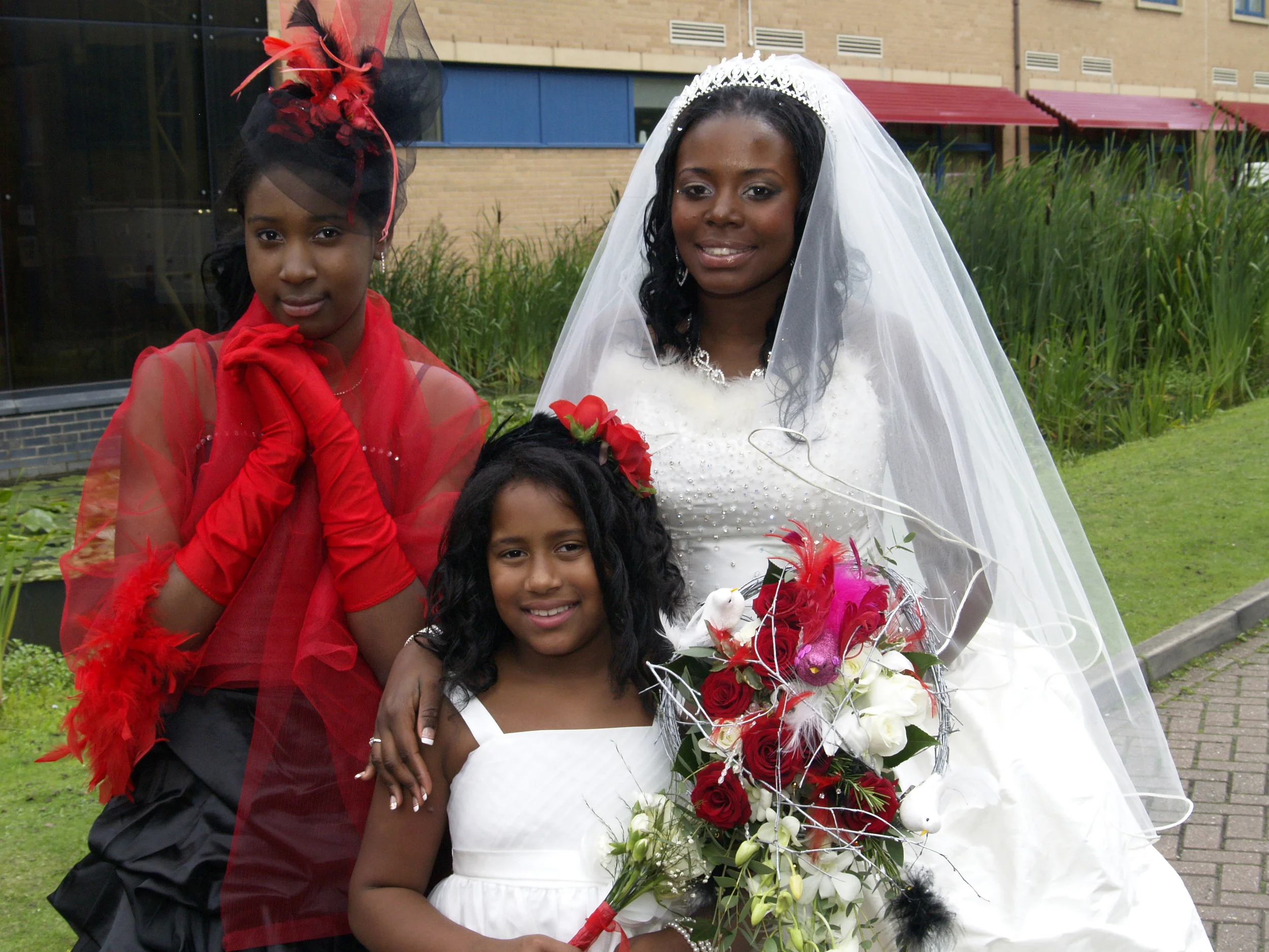 The two business sisters! with one of my flower girls Naiomi