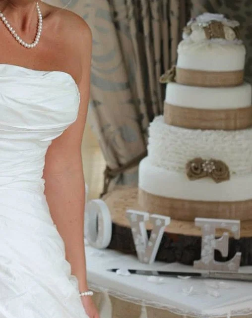 cake toppers and handmade flowers, decorations and ribbon for your wedding cake.