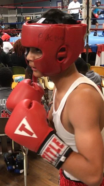 Erick Acost in headgear warming up for his bout.