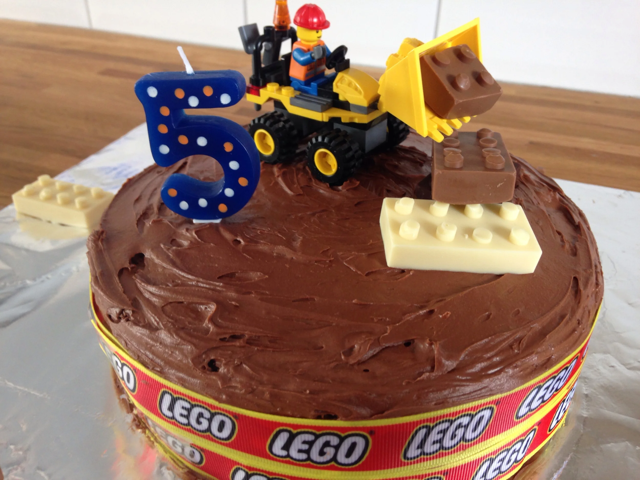 Homemade chocolate fudge cake with edible Lego.
