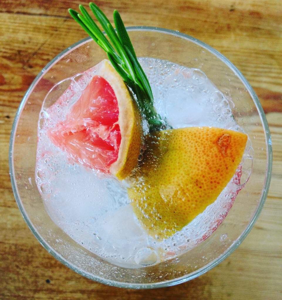 Fresh grapefruit, rosemary & ice with sparkling water.