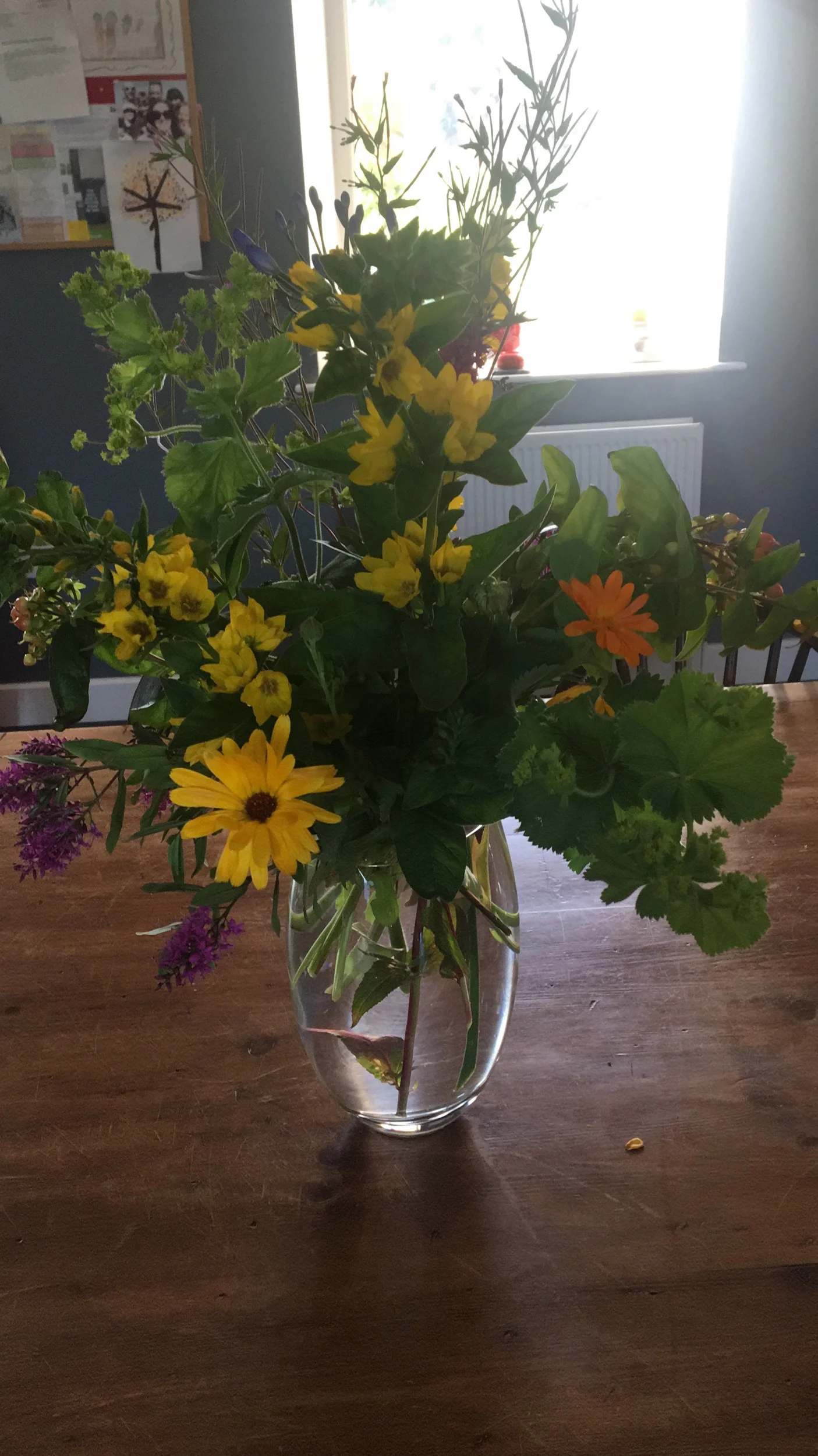My mother-in-law’s beautiful arrangement with garden flowers.
