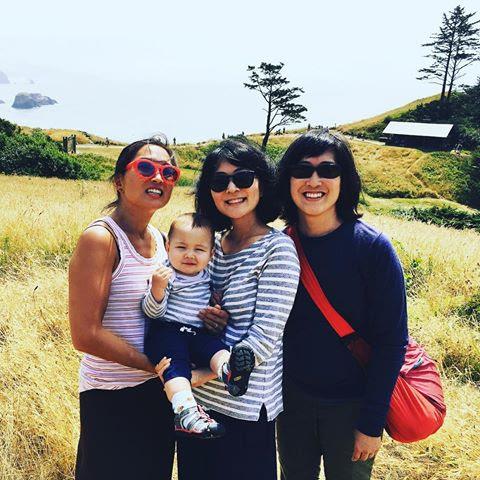 Carolyn and her two sisters and nephew Silas on vacation by the ocean in Portland.