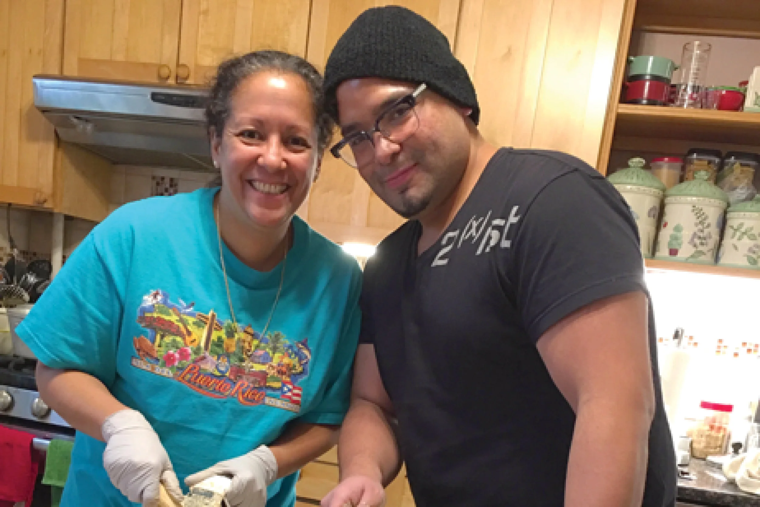 David with his sister, Rosa, making pasteles, a traditional Puerto Rican dish served during Christmas.