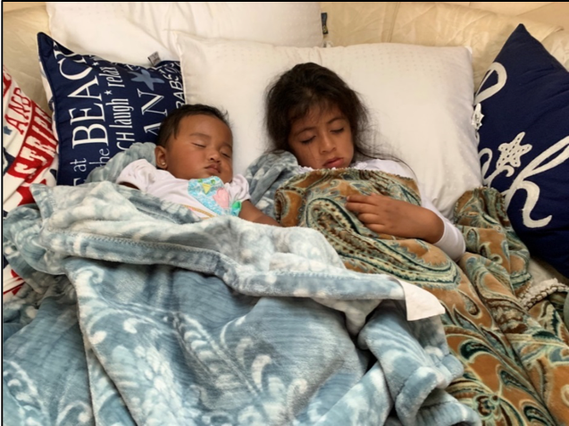 Sisters Genevieve and Madeleine, snug as two bugs in a rug!