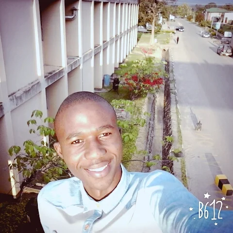 William takes a selfie at his university.