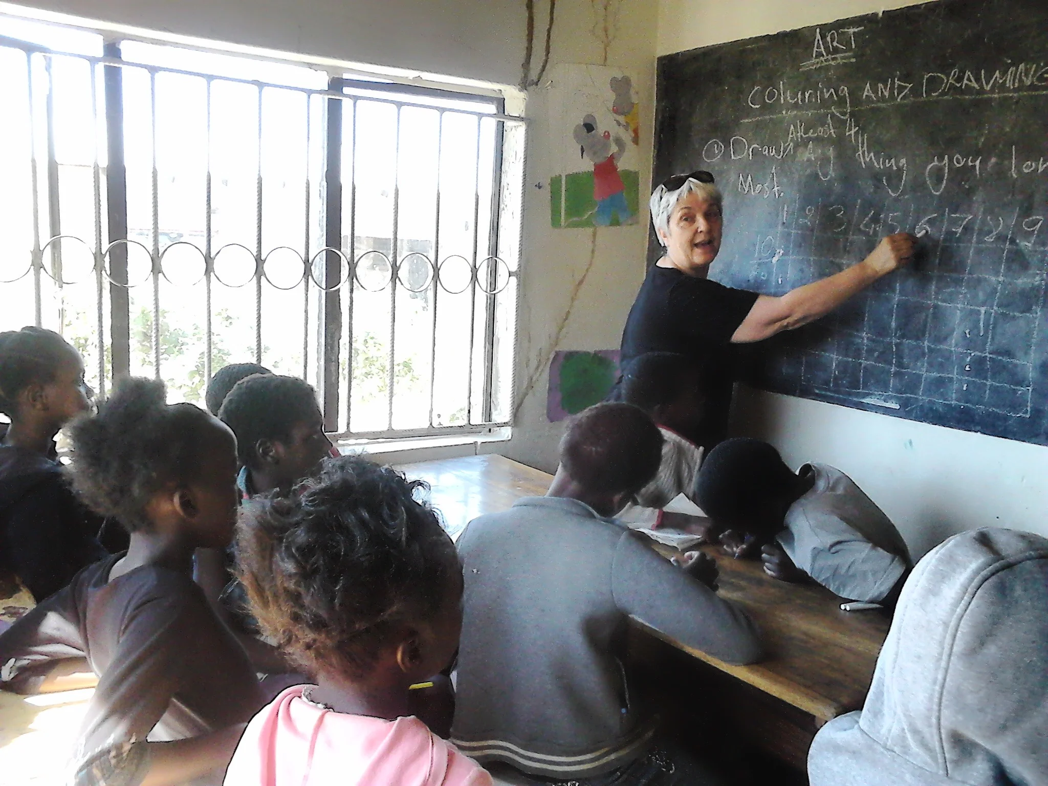 Momma Mario, in July 2019, teaches students at the youth center.