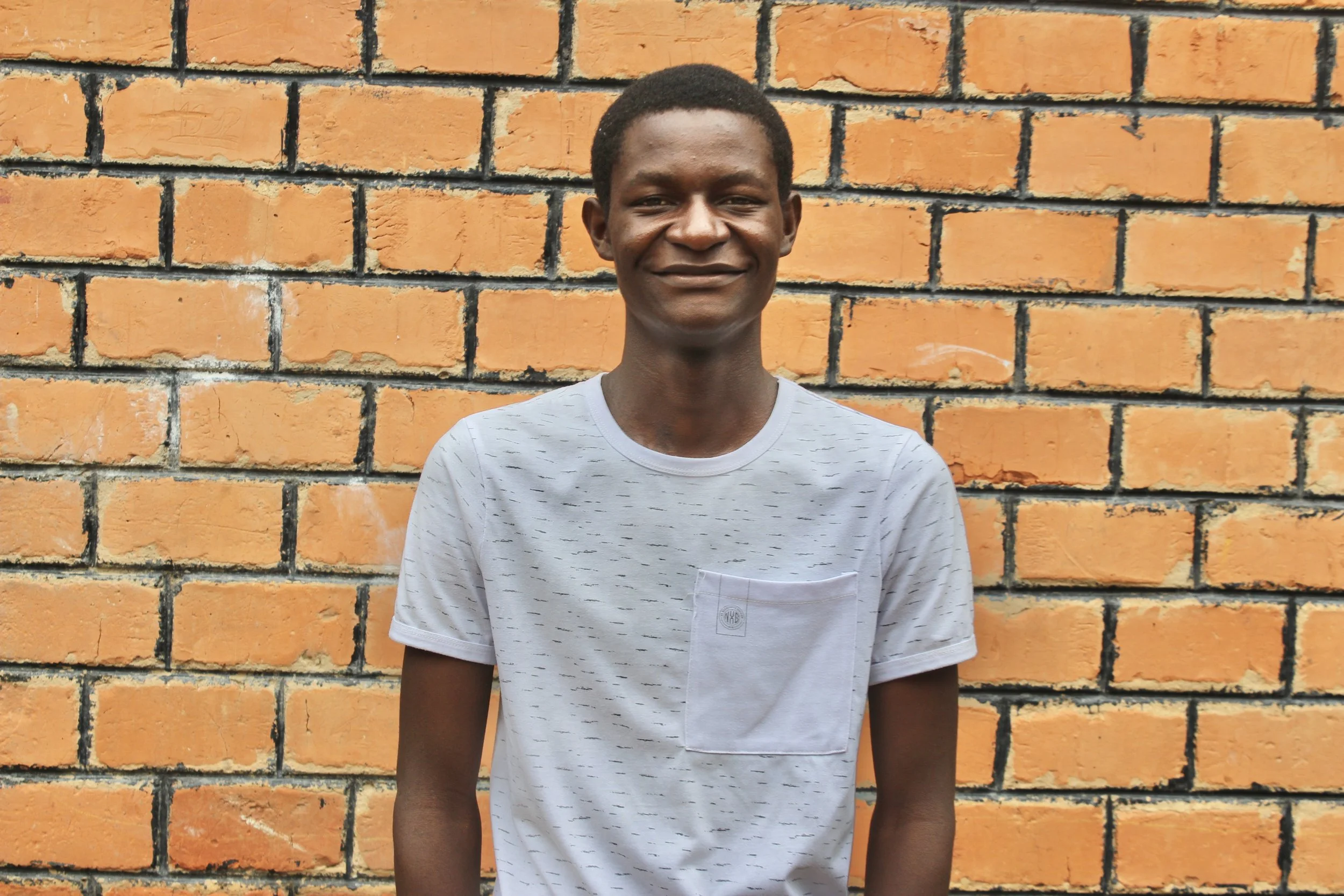 Young Zambian man smiles for the camera