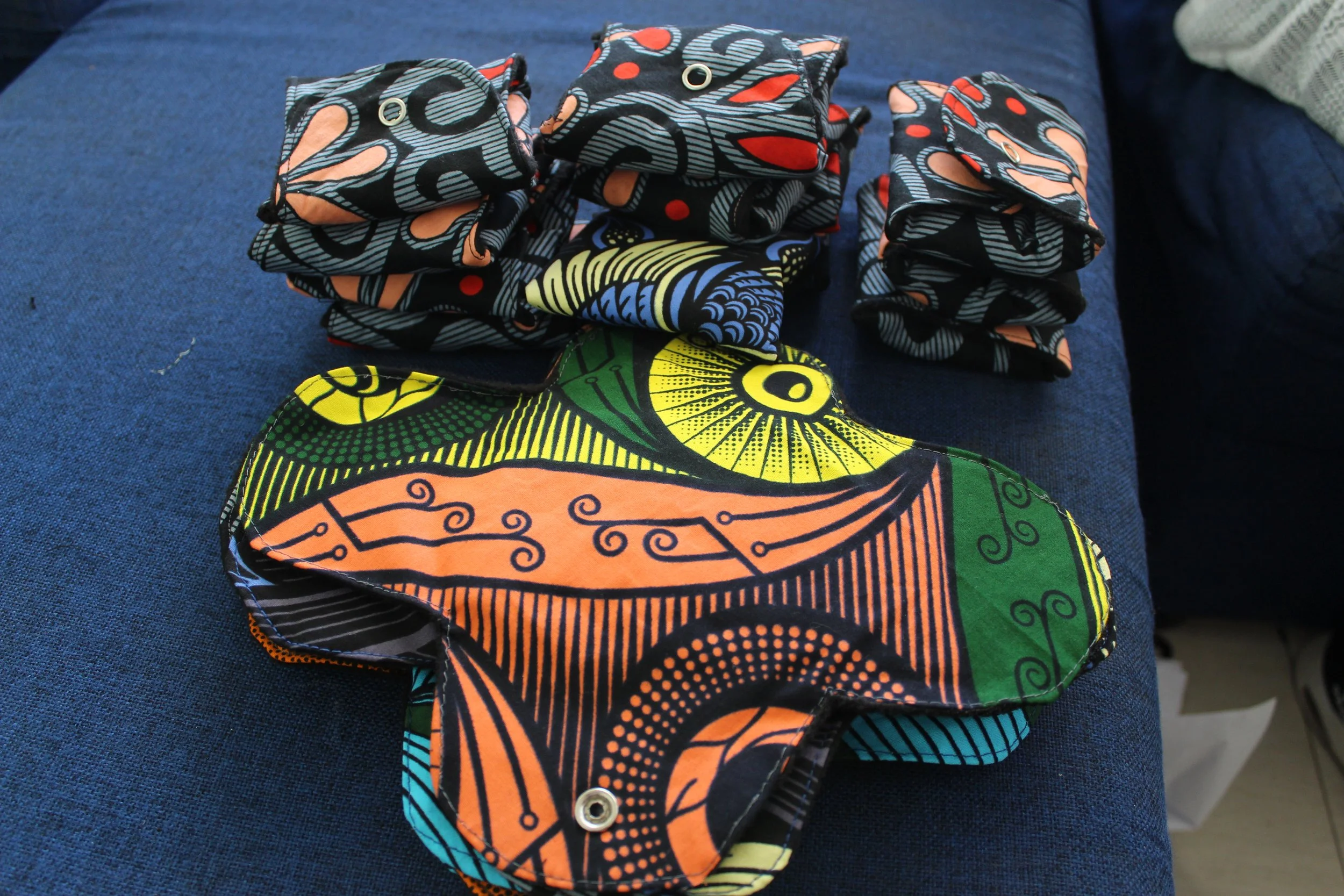 A picture of colorful menstrual pads created with Zambian chitenge fabric.