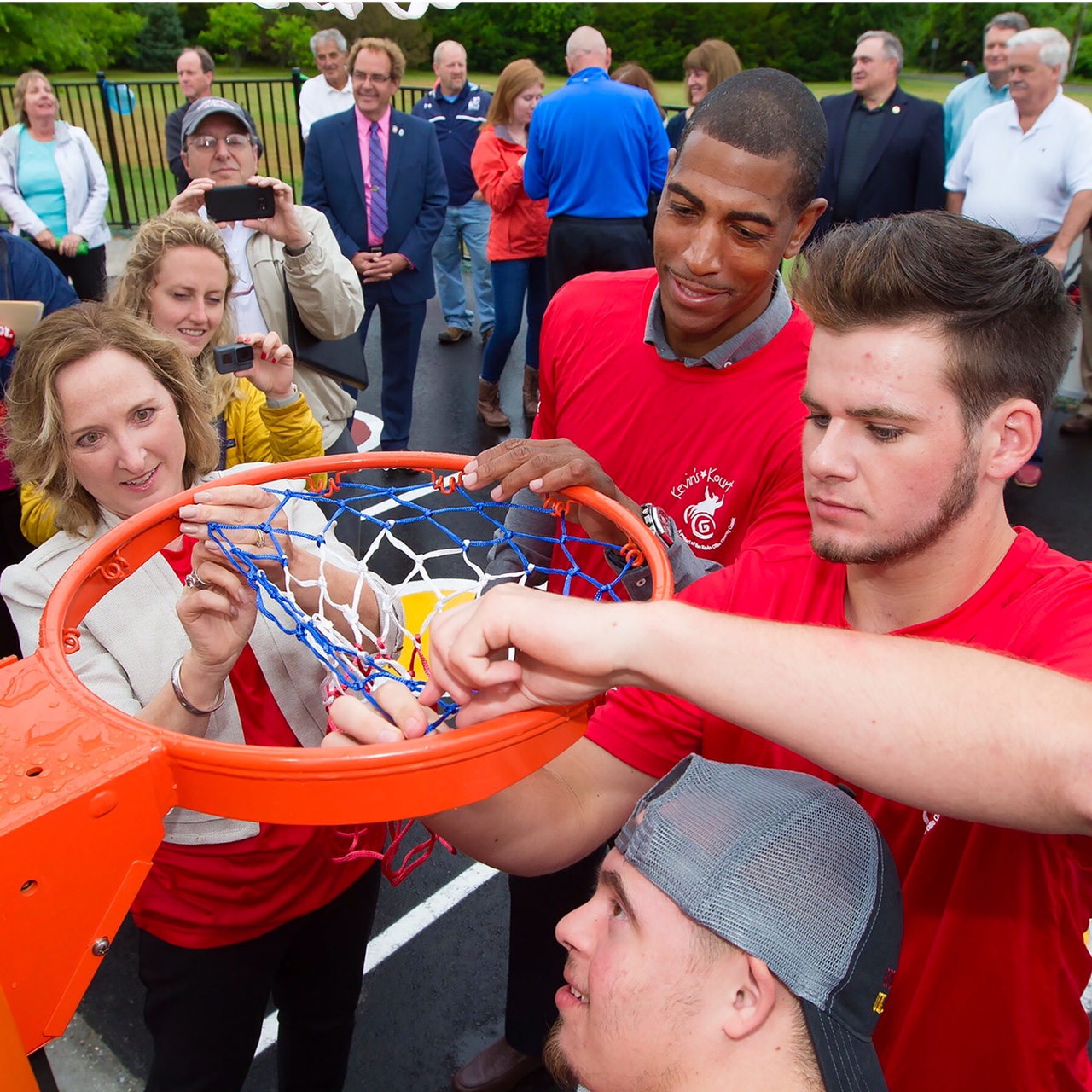 Coach Ollie joined by South Windsor Unified Sports members and Mayor Carolyn Mirek in net hanging ceremony.