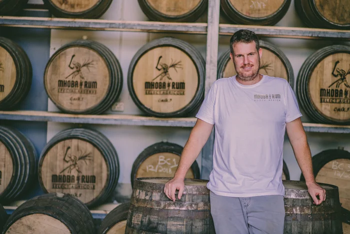 robert in front of the casks.jpg