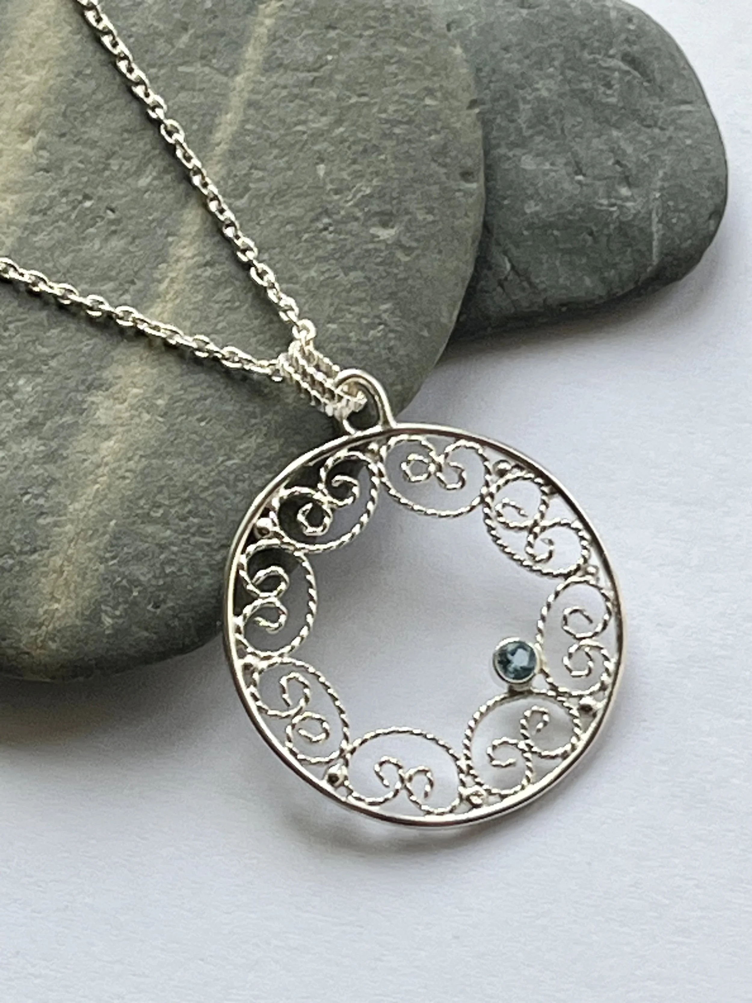 Silver filigree pendant with blue topaz.JPEG