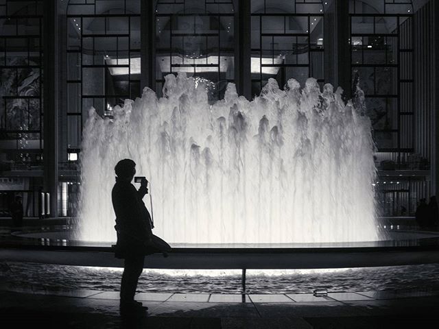 A photo of a photographer at the Lincoln Center.

#lincolncenter #fountain #bw #nyc #ny #newyork #newyorkcity  #fujifilm #x100f #tlpicks #stellerstories�#thecreatorclass #icapturedaily
#passionpassport #igtravel #natgeotravel
#lonelyplanet #redditpho