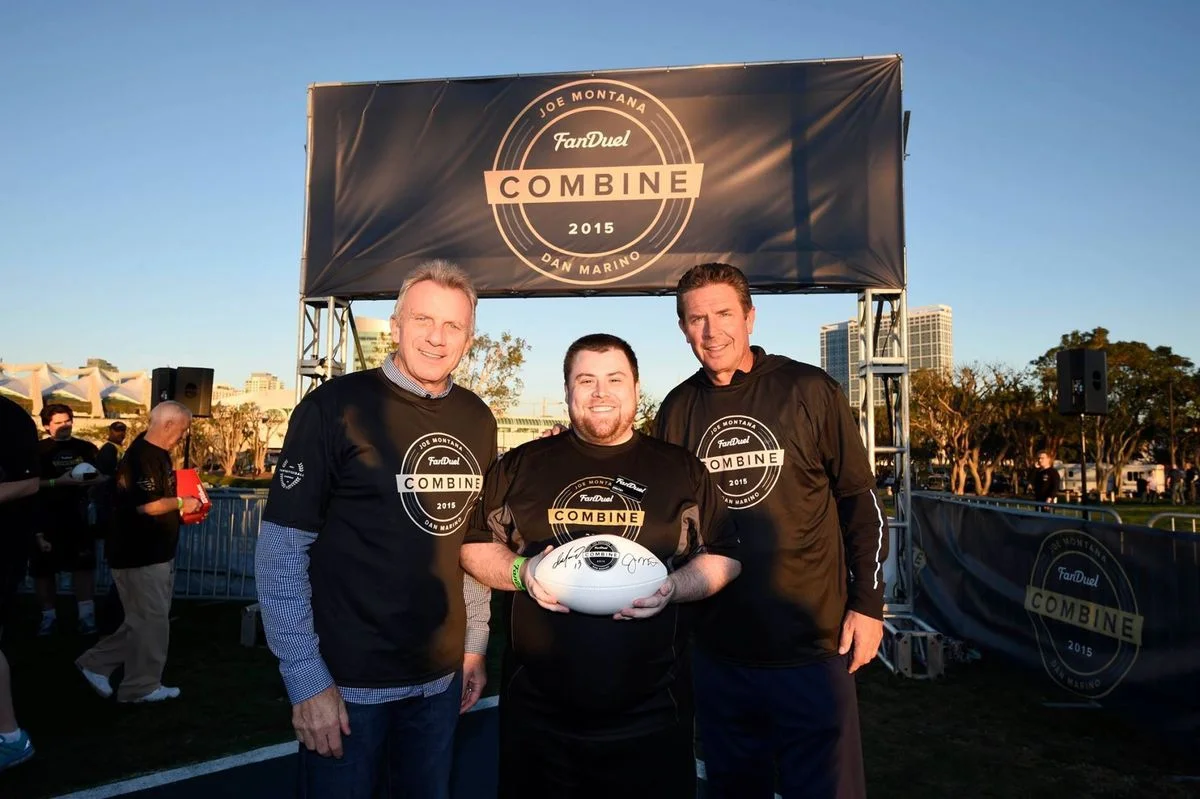 Dan Marino & Joe Montana greet a Fanduel player at the 2016 World Fantasy Football Championship