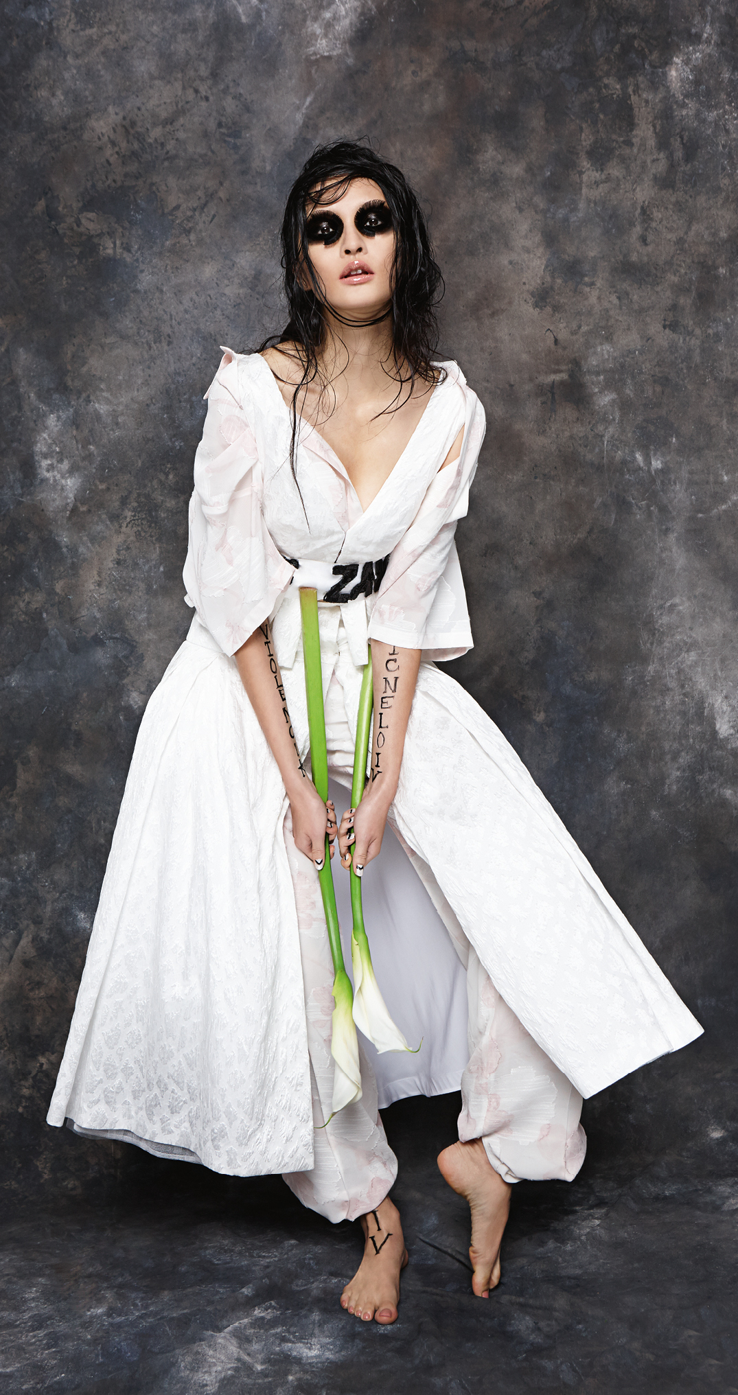 White peplum crop top and full skirt, both Natasha Zinko. Pink floral shirt and wide trousers, both Zeynep Tosum.