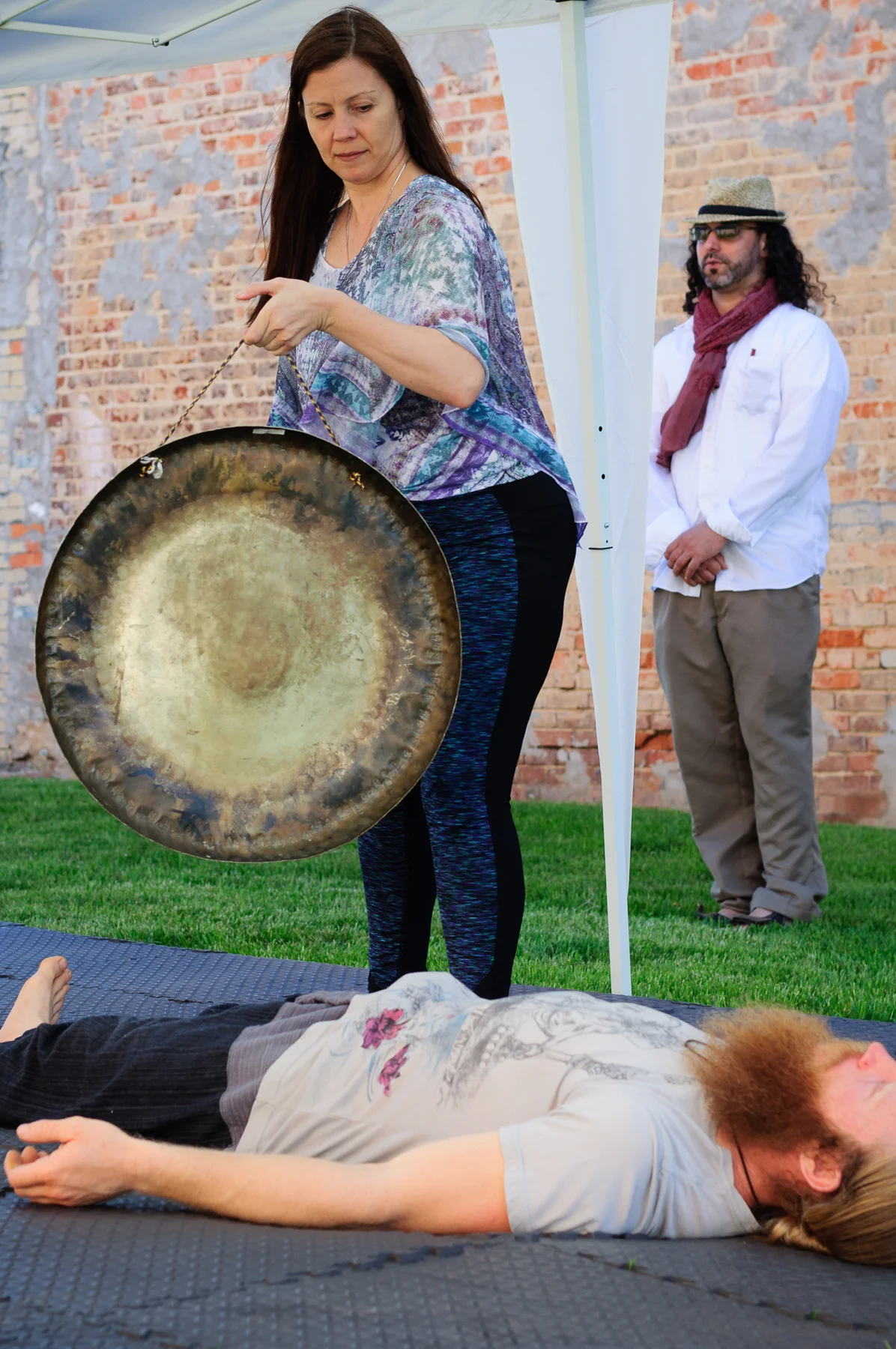 Barbara Cole and Jason Chaussee during their Self-Love Gong Meditation at the Pocket Park. 