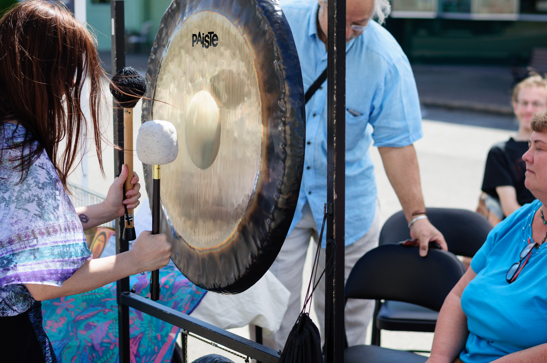 Festival goers experiencing the stress relieving benefits from gong therapy. 