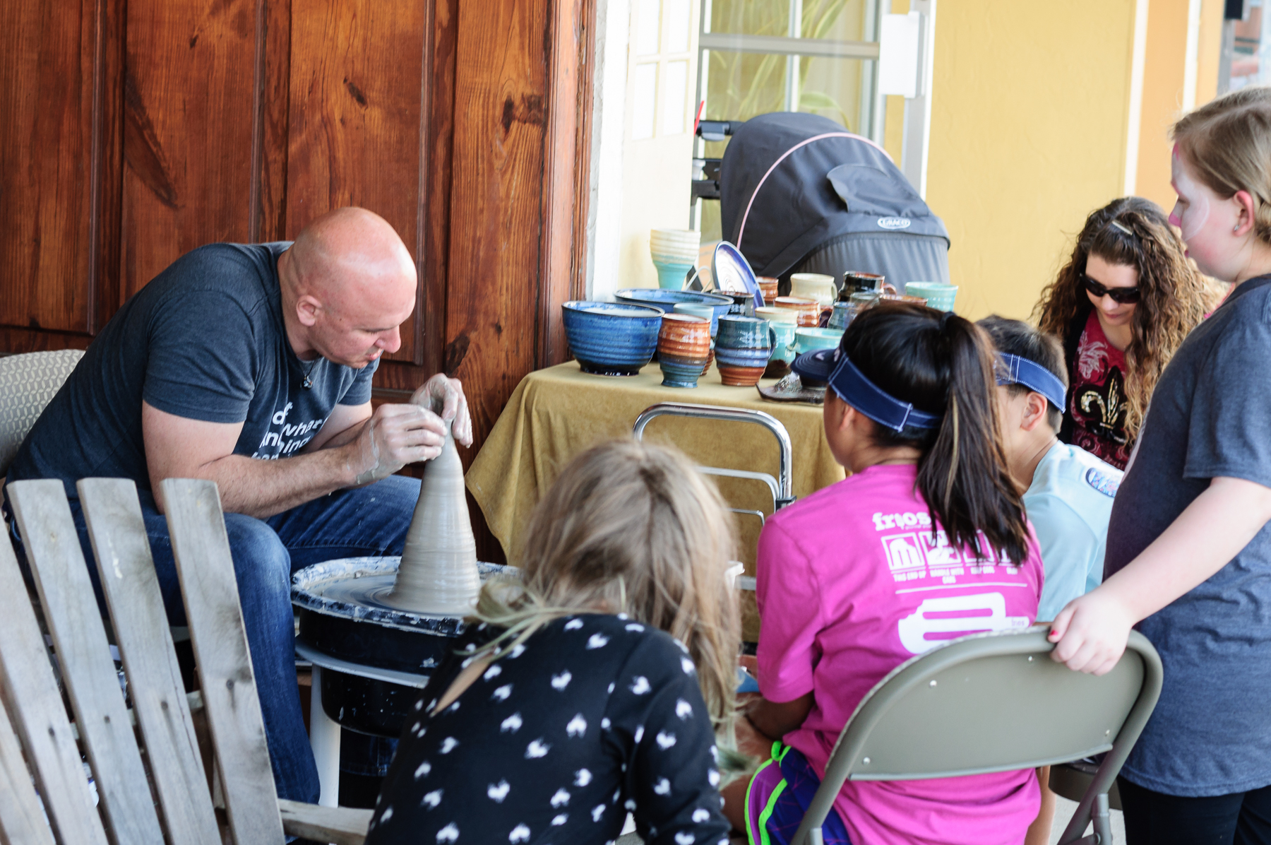Crowds gathered to watch artist Robert Ostman make his creations on his spinning wheel, dazzling them with conversation and incredible craftsmanship.