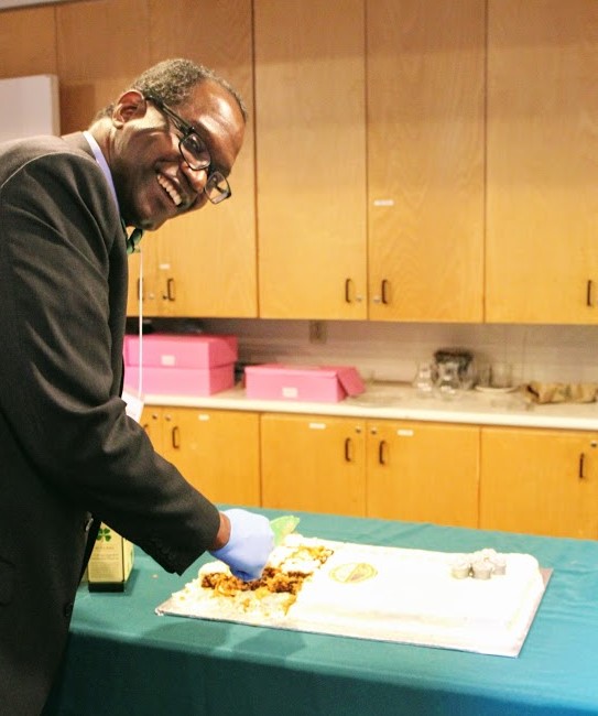 Rolando Thorne about to cut our Anniversary Cake