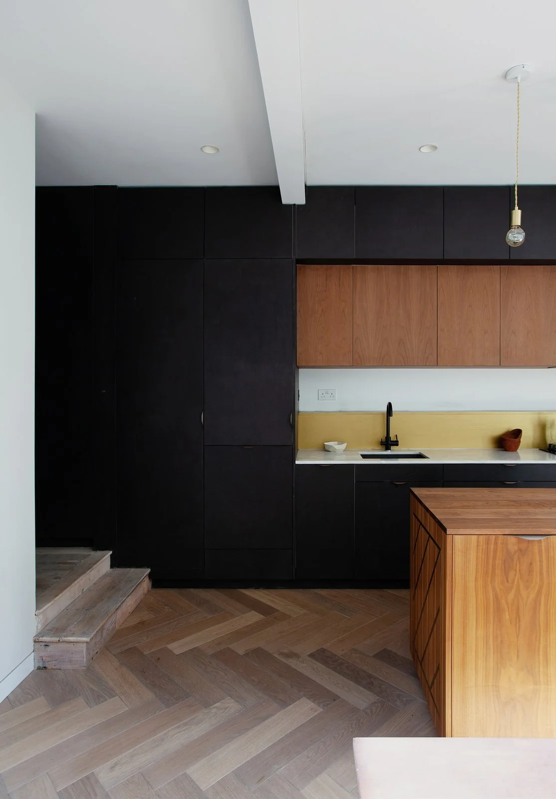 dumas-kept-a-relatively-simple-palette-when-it-came-to-the-interior-floor-to-ceiling-cabinetry-in-the-kitchen-acts-as-an-effective-noise-barrier.jpg