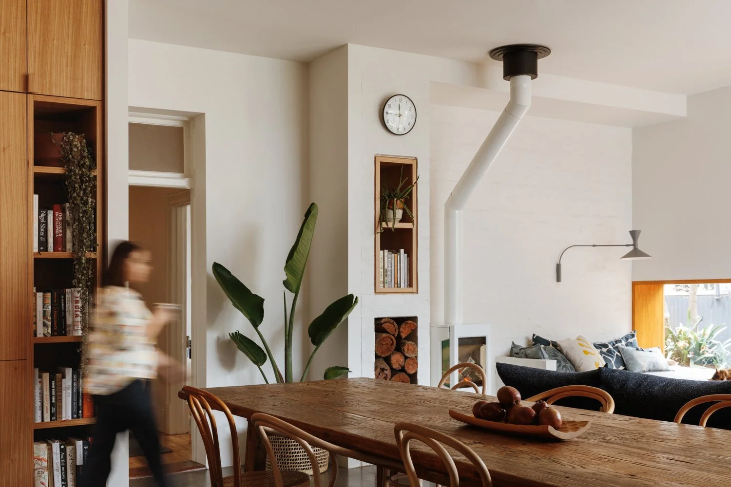 the-former-exterior-wall-is-now-a-textural-accent-in-the-living-room-that-syncs-with-the-concrete-wall-in-the-kitchen.jpg