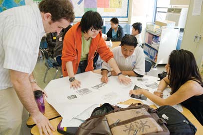 AP Kevin Hesseltine provides support for a students working on projects.