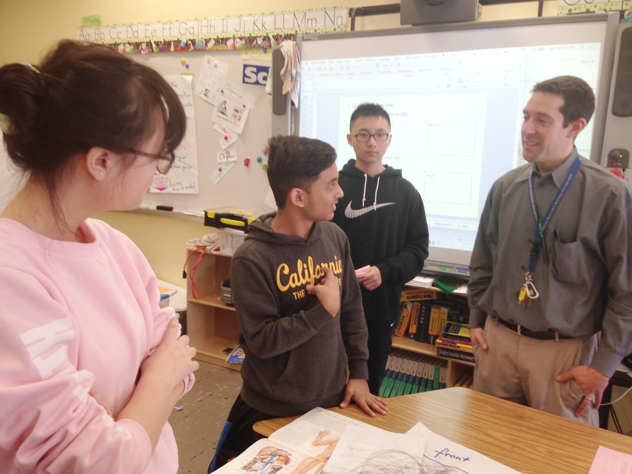 FIHS Science teacher Jordan Wolf with students