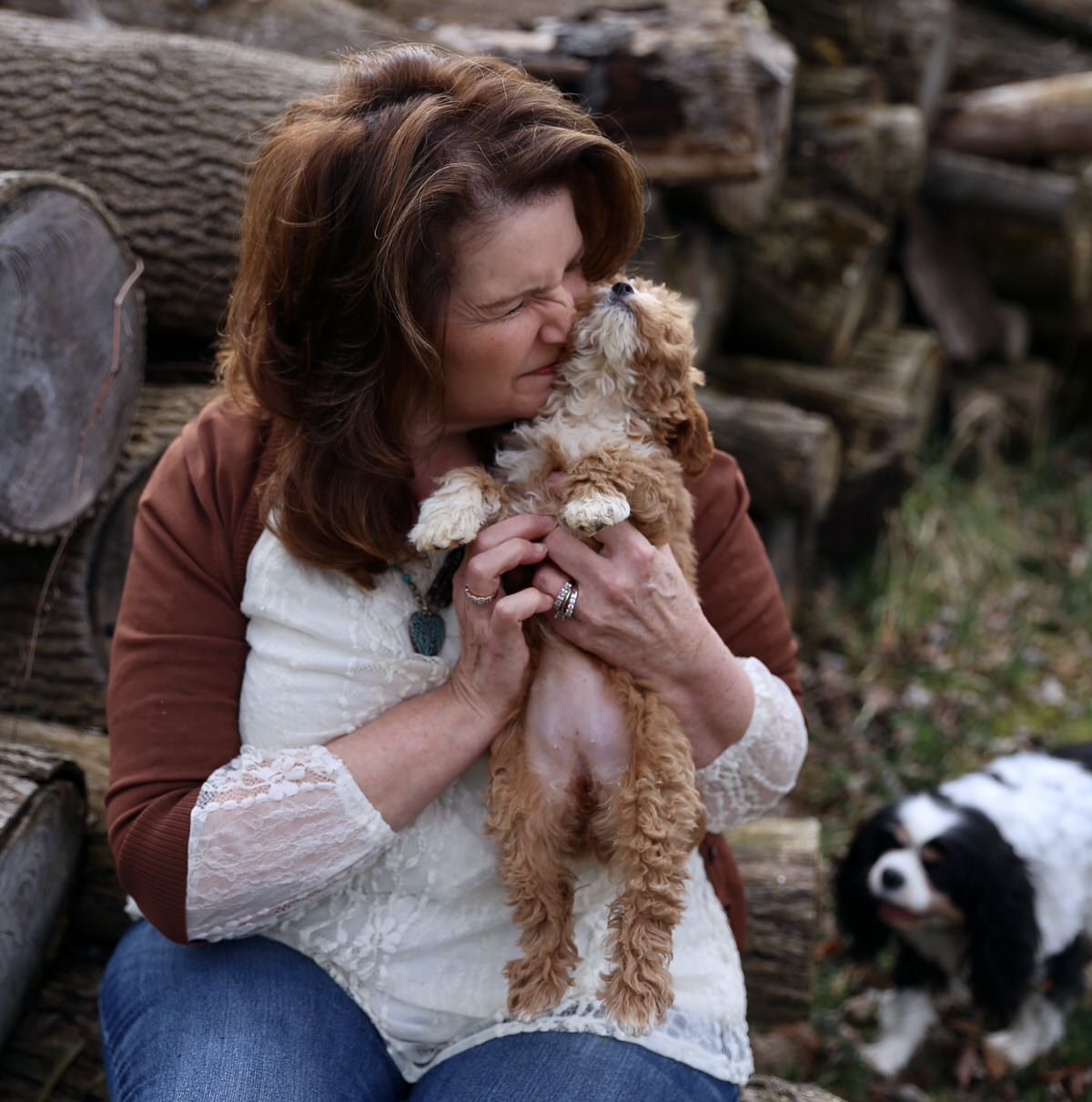 terry-hugging-cavapoo-puppy-reviews-banner.jpeg