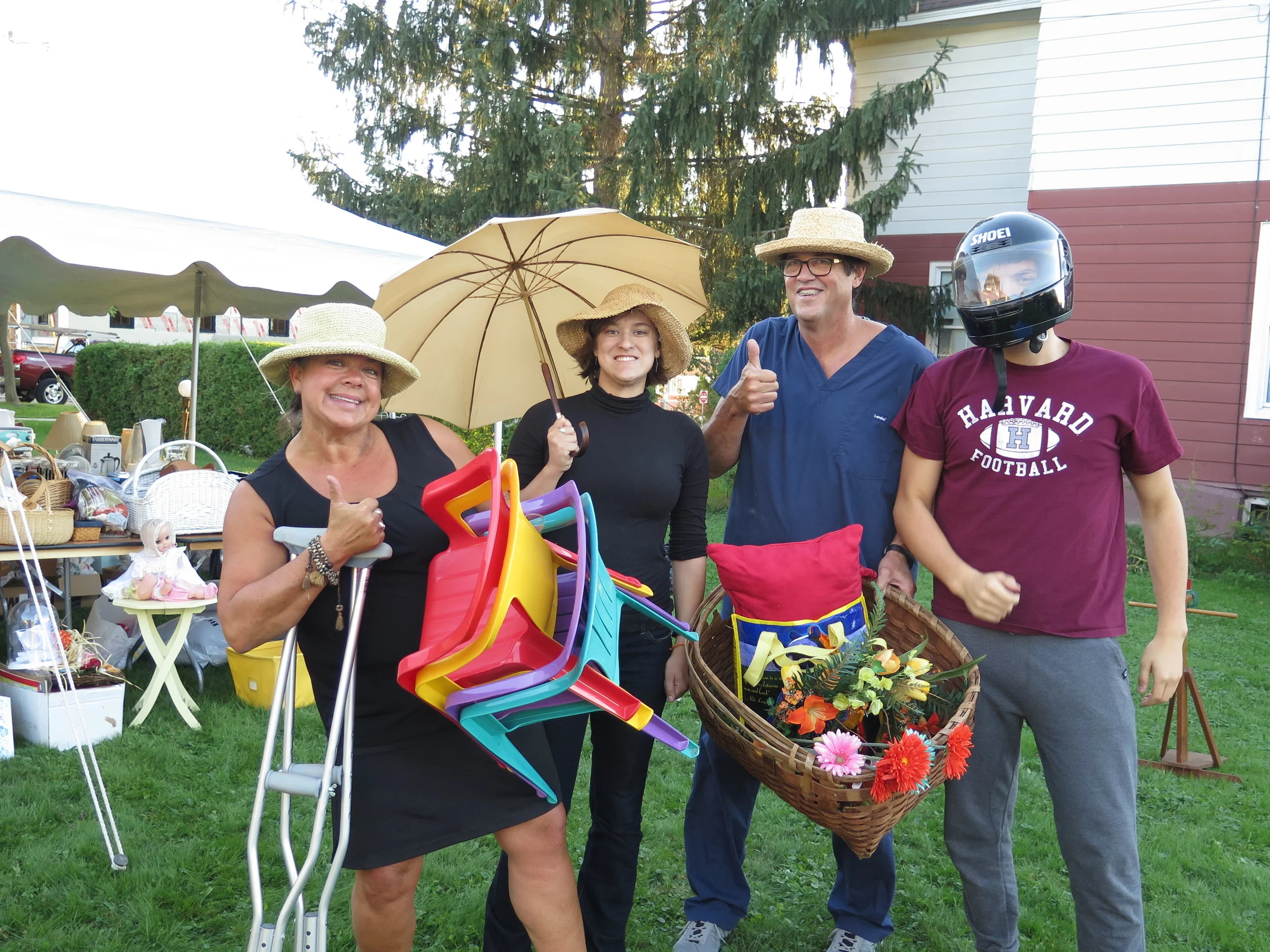 the ulrich / verderber clan show off some of the items at the community yard sale that fiddlehead hosts every year!
