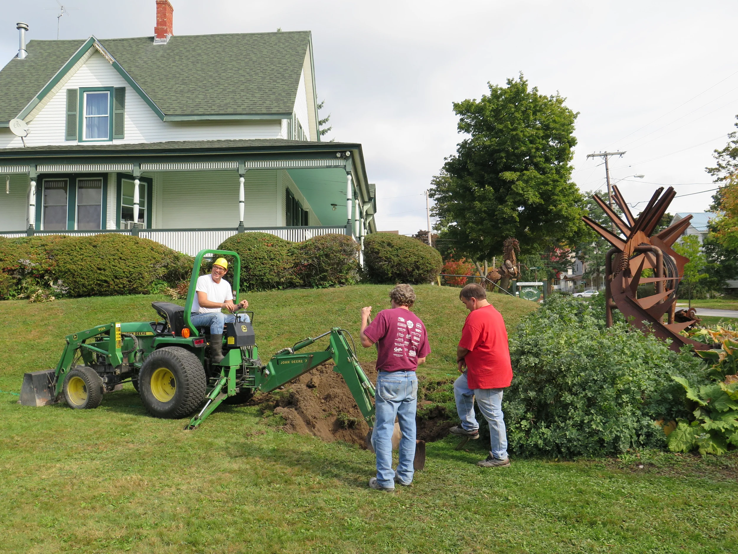dr. chuck can wear many hats! here he digs up the office septic line to clear a blockage that put the office without sewer access for a business day.