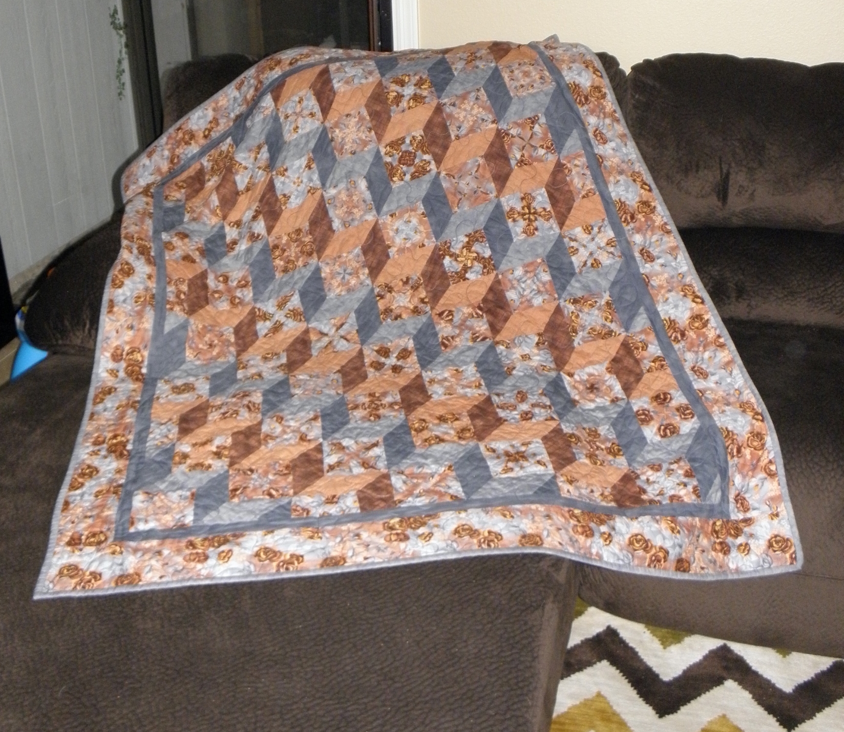 Stack 'n Whack tumbling block lap quilt made circa 1990's.