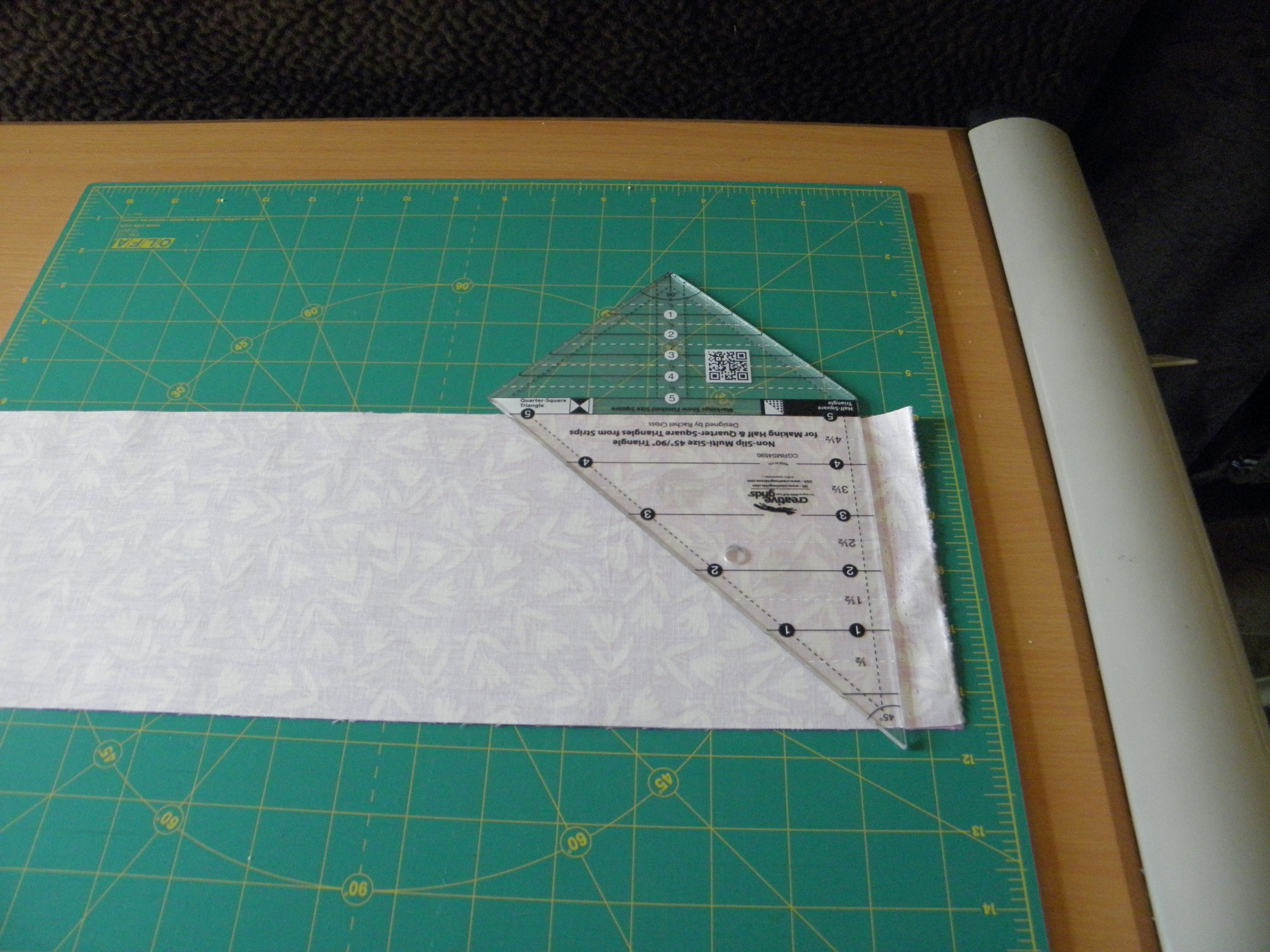 Use the ruler to trim off the selvage.