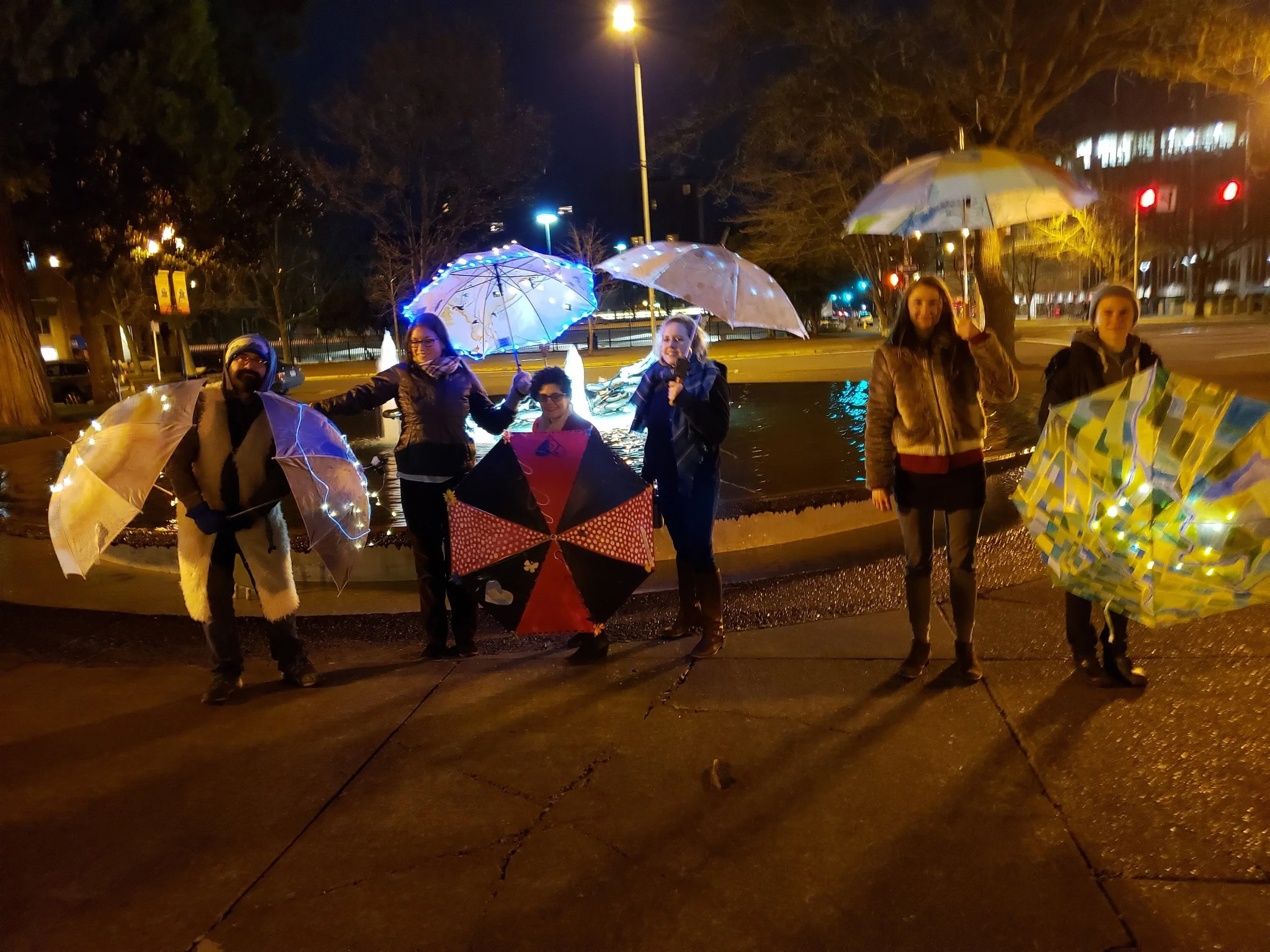 Wanderlust Umbrella Project ArtCity February 19th, 2019 The Umbrella Project embraces the rain and the darkness of winter by illuminating and transforming Downtown Eugene with an ever-changing display of live, time-based art. The Umbrella Project is presented by ArtCity Eugene and Cultural Services, City of Eugene. Upcoming Umbrella Project Appearances Wanderlust February 19, 5:50-6:50 pm Nimbus February 20, 5:50-6:50 pm Zoe Troupe February 22, 5:50-6:50 pm Vanessa Fuller Dance February 25, 5:50-6:50 pm David CP & Apprentices February 26, 5:50-6:50 pm Vanessa Fuller Dance February 27, 5:50-6:50 pm The Umbrella Auction March 1, 6:30-7:30 pm / Kesey Square Keep an eye out for your favorite umbrella. All umbrellas will be auctioned on Friday, March 1 in Kesey Square during the First Friday ArtWalk. Umbrella proceeds will benefit 15th Night , participating artists, and ArtCity Eugene (40-40-20)