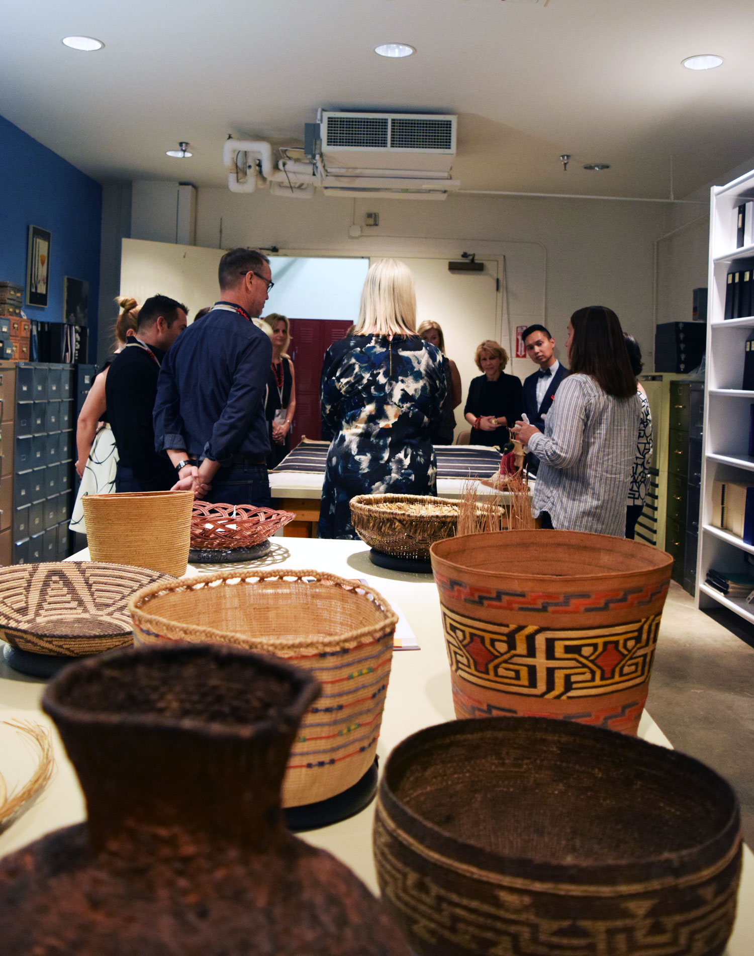 Touring the textile, pottery and basketry collection at the Museum of Indian Arts & Culture.