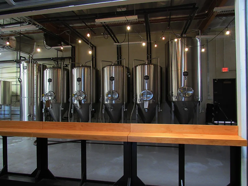 EVENING: TEMPORARY BAR SETUP LOOKING INTO BREWERY